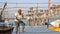 DIU, INDIA - JANUARY 9, 2014: Fisherman installing fish at Vanakbara Fishing port in Diu Island