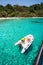 Dive boat heading to the island in a tropical sea