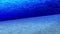 Dive in the ocean. Underwater view sun rays and air bubbles in deep blue sea. Luxury summer vacation concept. Loop animation.