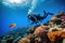A diver exploring a vibrant coral reef with a school of colorful fish swimming around them