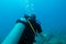 Diver in the ocean with aqualung. Adventure tourism.