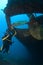 Diver with Propeller of wreck Hilma Bonaire