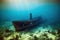 Diver underwater view of the mysterious wreckage of an ancient ship at the bottom.