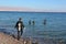 Divers diving in Coral Beach Nature Reserve in Eilat, Israel