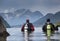 Divers entering water in mountain lake