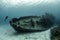 Divers examining the famous USS Kittiwake submarine wreck in the Grand Cayman Islands