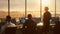 Diverse Air Traffic Control Team Working in a Modern Airport Tower at Sunset. Office Room is Full of