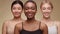 Diverse beauty. Happy african american lady smiling widely to camera, posing with asian and caucasian female friends