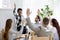 Diverse business people group raise hands at corporate presentation training