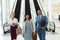 Diverse business people standing in front of escalators in modern office