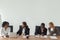 Diverse business people working talking at conference table, cor