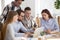 Diverse business team listen to executive training explain computer task