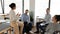 Diverse business team sitting in circle in office and talking