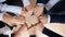 Diverse businesspeople join hands engaged in teambuilding together
