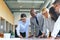 Diverse businesspeople solving a jigsaw puzzle in an office