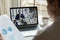 Diverse businesspeople talk on video call on laptop