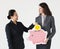 Diverse businesswomen holding pink piggybank icon investment concept