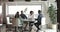 Diverse colleagues or partners handshaking negotiating in modern meeting room