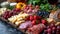 A diverse continental breakfast spread with an array of fruits, cheeses, cold cuts and fresh bread