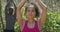 Diverse couple practicing yoga and posing in countryside