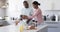 A diverse couple is preparing breakfast together in a modern kitchen