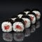 Diverse delicious sushi roll set on a black background with reflection, menu