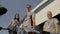 Diverse doctors in uniforms stand outdoors at the hospital entrance