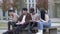 Diverse Ethnic Group Enjoying a Campus Reunion on a Bench.