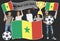 Diverse football fans holding the flag of Senegal