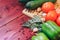 Diverse fresh vegetables on wood background. tomato, cucumber, bell pepper