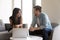 Diverse friends colleagues sit in office room having informal talk