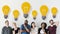 Diverse friends with lightbulb icons creative concept