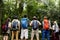 Diverse friends trekking together in a forest