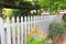 Diverse Garden With White Picket Fence