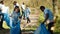 Diverse group of activists gathering to clean up a forest area