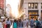 Diverse group of anonymous people walking down busy urban street in New York City