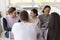 Diverse group of cheerful friends meeting in cafe