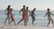 Diverse group of friends enjoy a day at the beach