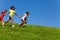 Diverse group of happy fast running children