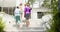 Diverse group of senior women ascend outdoor steps after a yoga session