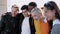 Diverse group of united young friends laughing together outdoor