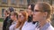 Diverse group of young caucasian girls standing in profile outside together looking away
