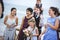 Diverse guests enjoy beach wedding party