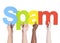 Diverse Hands Holding the Word Spam