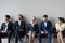 Diverse job candidates sitting waiting in queue for interview