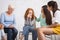 Diverse Ladies Supporting Girl Crying During Group Psychotherapy Indoor