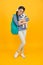 Diverse learning environments designed to meet the needs. Teen with backpack. Cute smiling schoolgirl carry soft toy dog