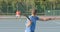 Diverse male tennis players playing tennis on outdoor court in slow motion