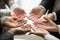 Diverse multi-ethnic business team members join hands together p