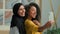 Diverse multiracial businesswomen happy joyful girls business partners Arabian muslim islamic in hijab and African